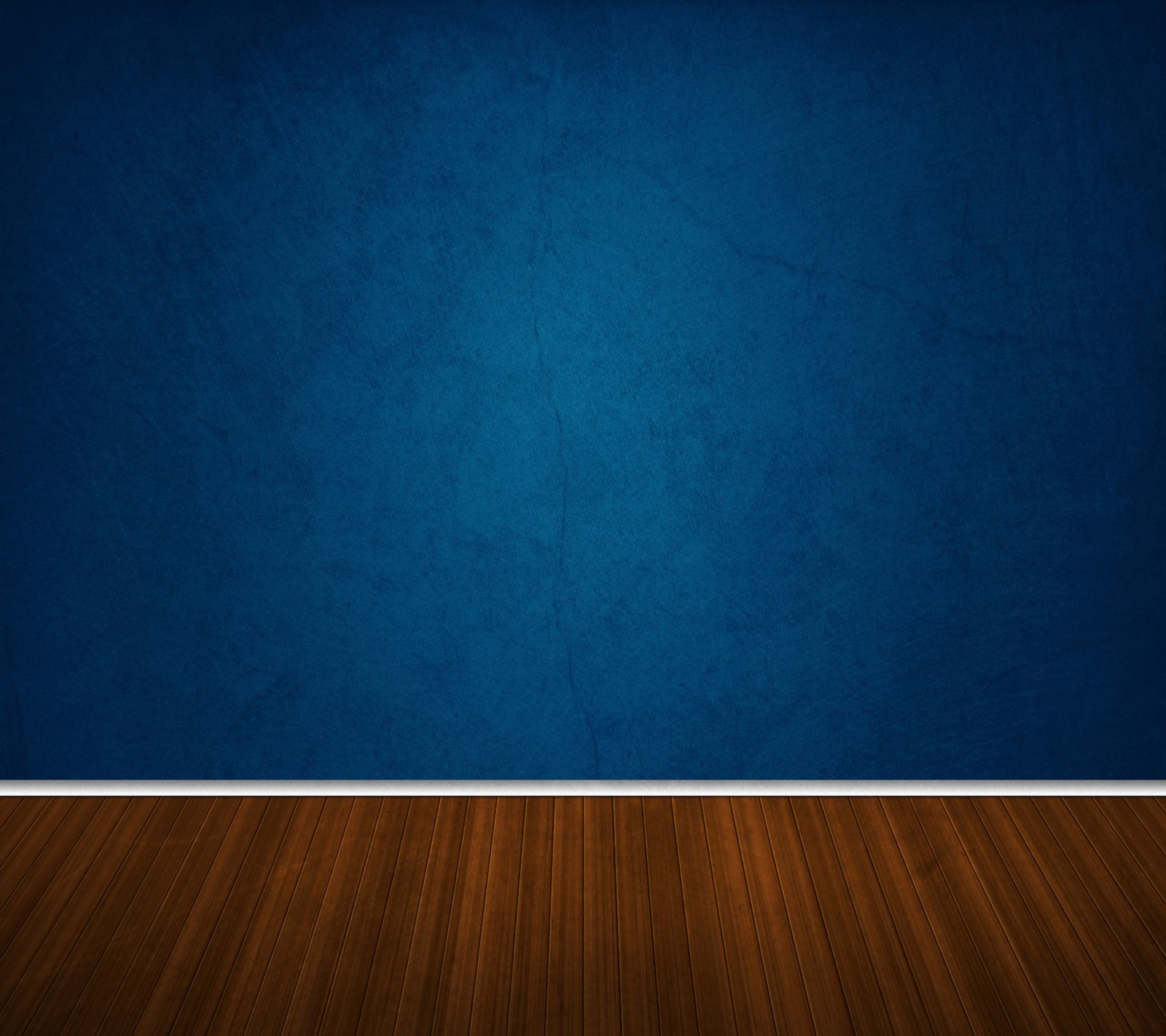 A blue wall with a wooden floor and a white trim (blue, blue wall, floor, hardwood floor, room)