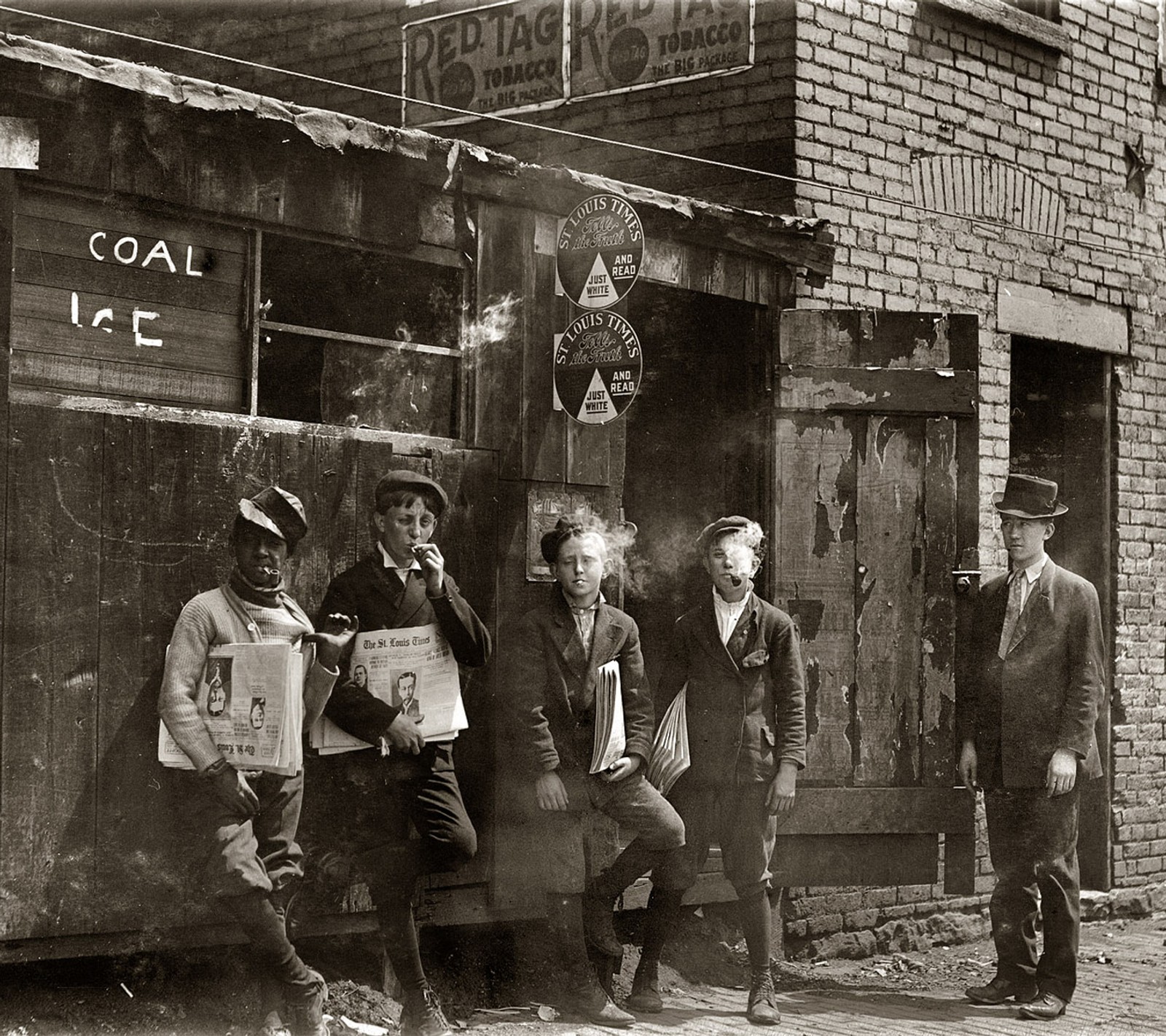 Several men standing outside of a building with a sign on it (american, cigarette, old photo)