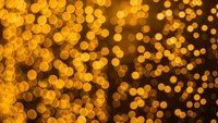 Warmes Bokeh-Licht mit gelben und orangefarbenen Mustern