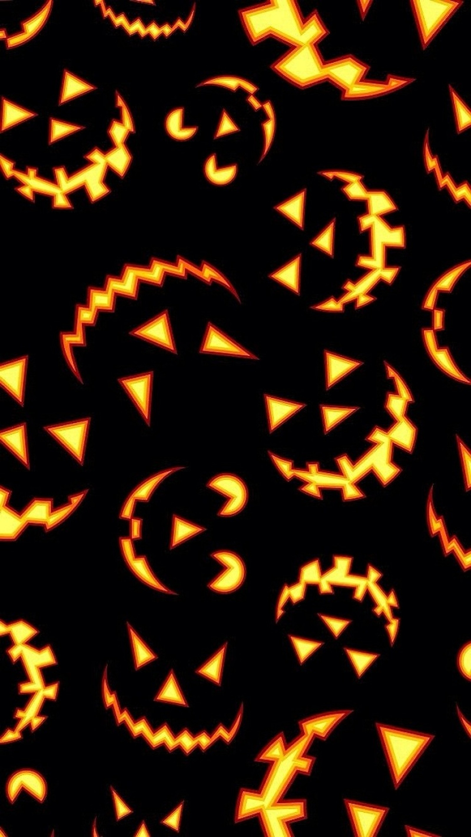 A close up of a bunch of pumpkin faces on a black background (halloween, pumpkin, scary)