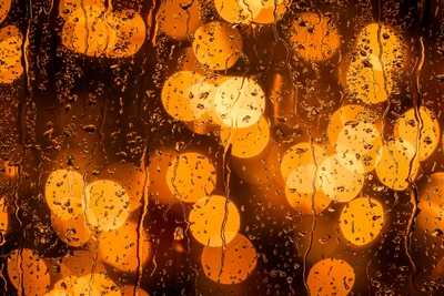 Bokeh dourado abstrato com gotas de chuva para reflexões de Ano Novo