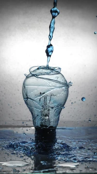 Illuminated Glass Bulb with Cascading Blue Water