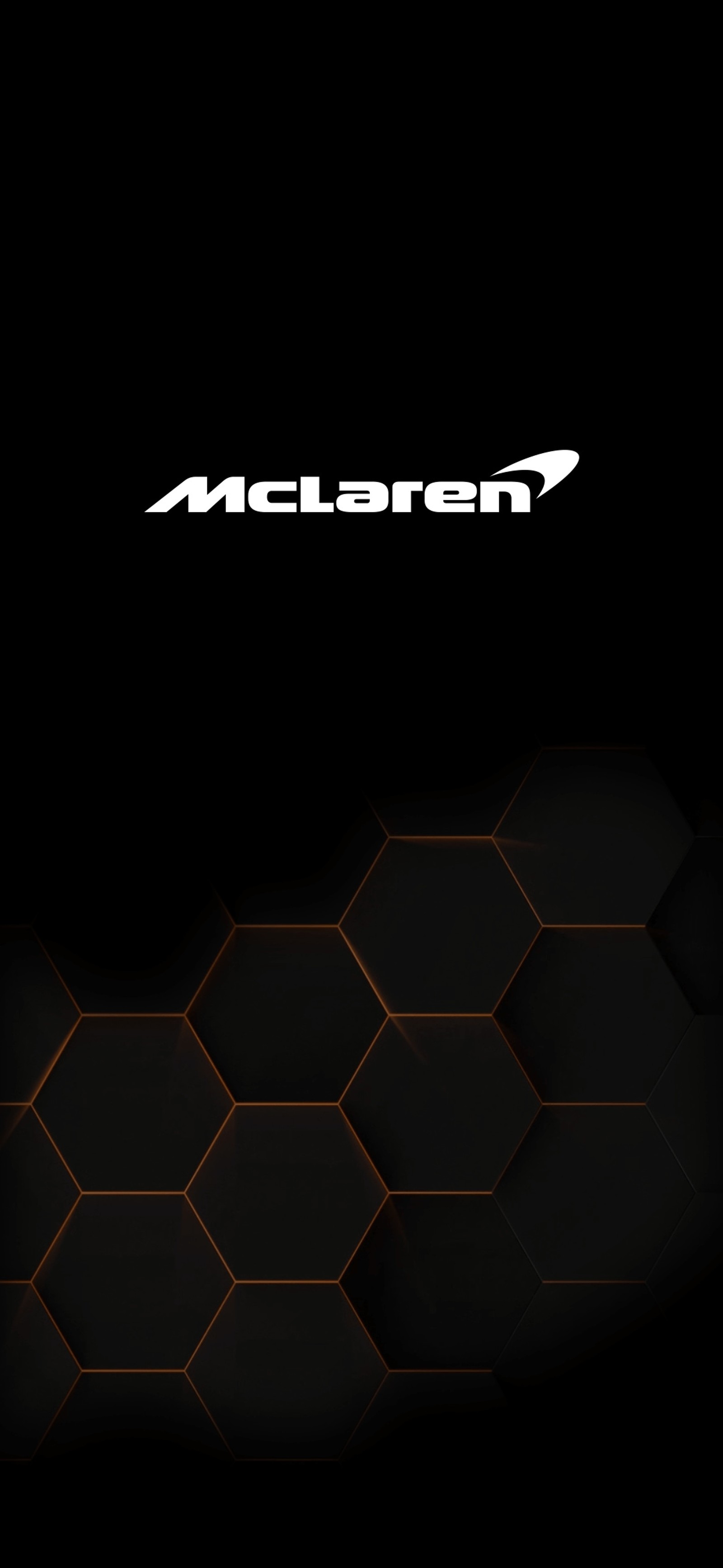 Um close-up de um celular com fundo preto (hexagonal, mclaren, oneplus, oneplus7tpro)