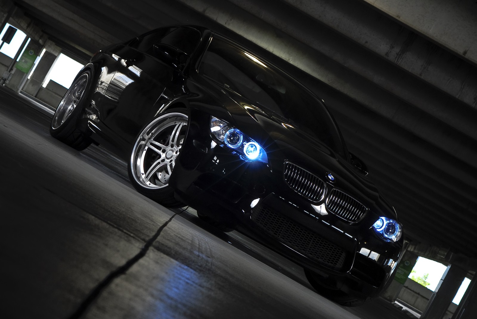 Arafed black car parked in a parking garage with blue lights (bmw 3 series, bmw 5 series, car, bmw, bmw m5)