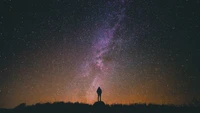 Silhouette Against a Starry Night Sky