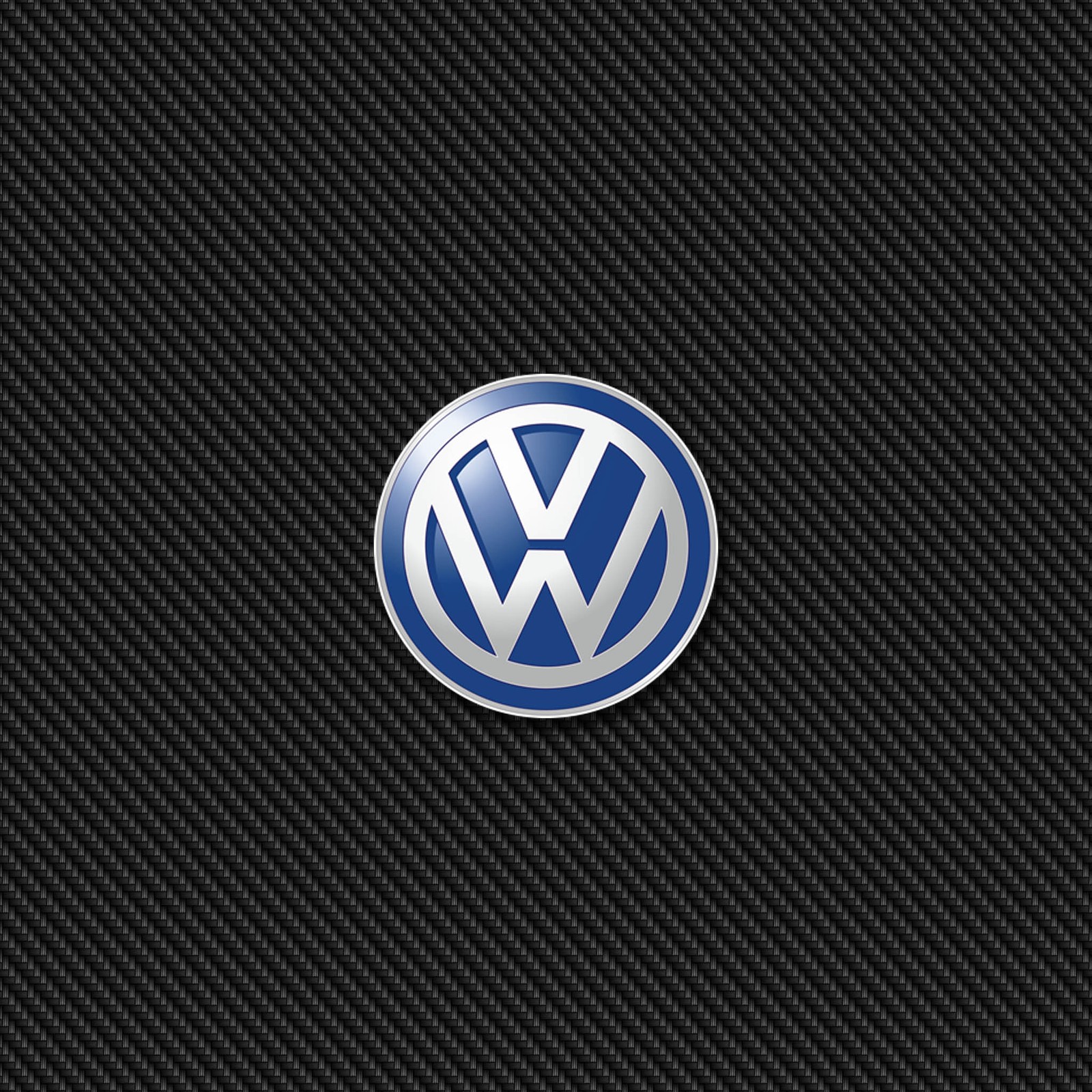 Un primer plano del logo de volkswagen sobre un fondo negro (automóvil, logotipo, volkswagen, vw)