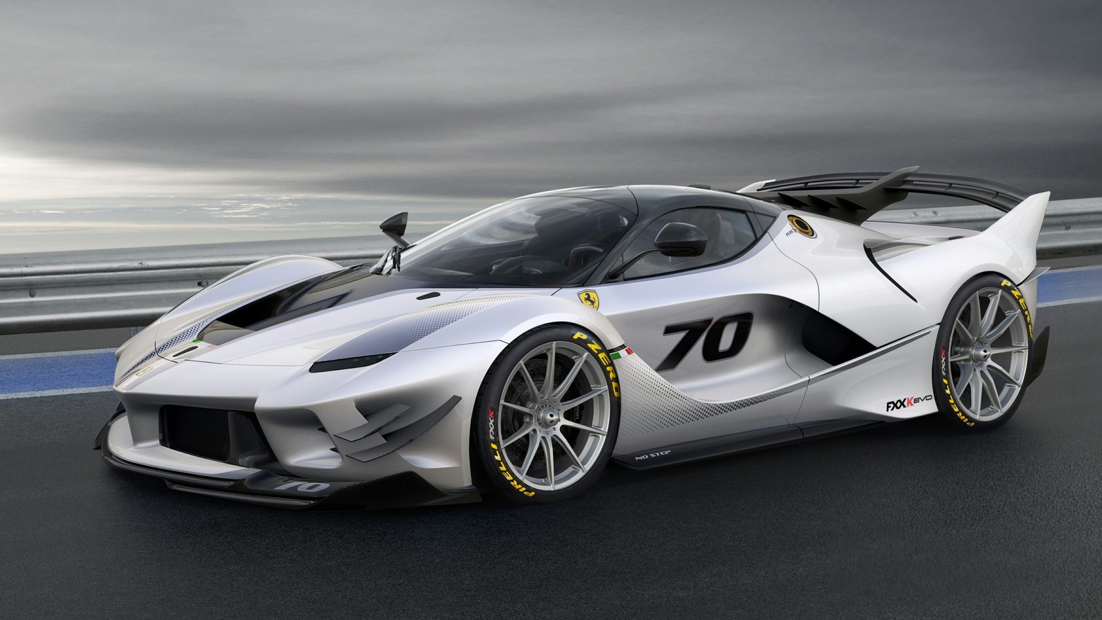 A white sports car driving on a track with a cloudy sky (ferrari fxx k, laferrari, ferrari 599 gtb fiorano, enzo ferrari, cars)