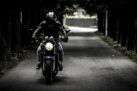 Monochrome Biker on a Roadway