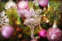 Whimsical Fairy Ornament Adorning a Festive Christmas Tree