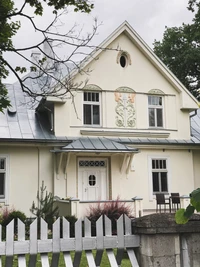 Charming Residential Home with Decorative Elements and Welcoming Entrance