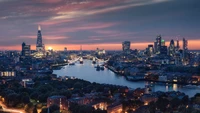 London Skyline at Dusk: Skyscrapers Reflected in the Serene River Under a Colorful Sky