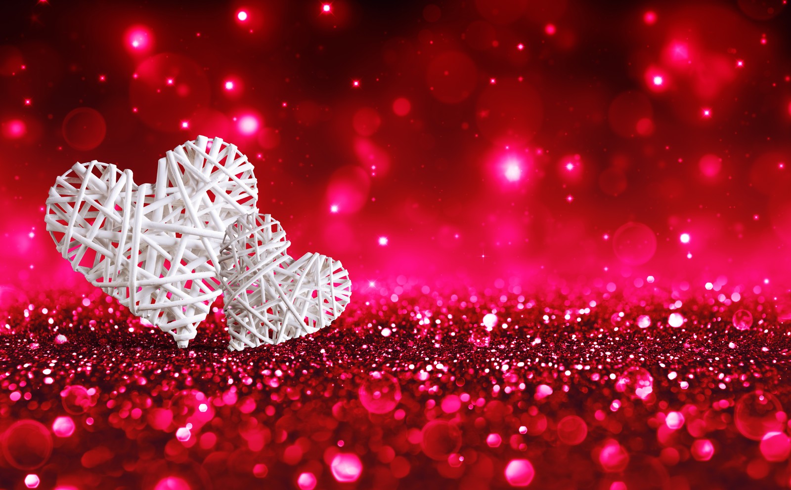 Two hearts on a red background with bokeh lights (heart, valentines day, glitter, pink, red)