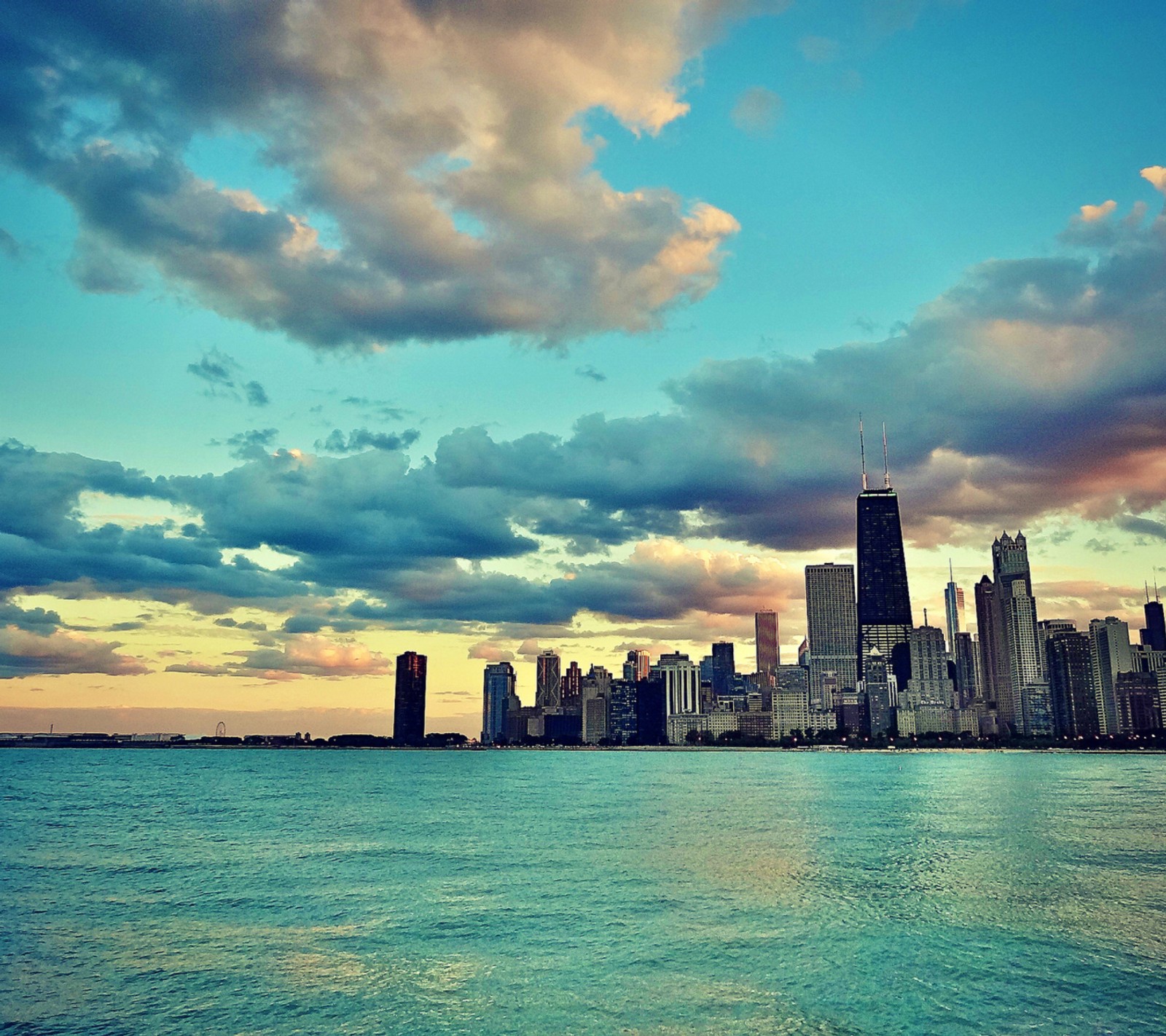 Vista aérea de un horizonte urbano con un cuerpo de agua (hermoso, chicago, hd, océano, cielo)