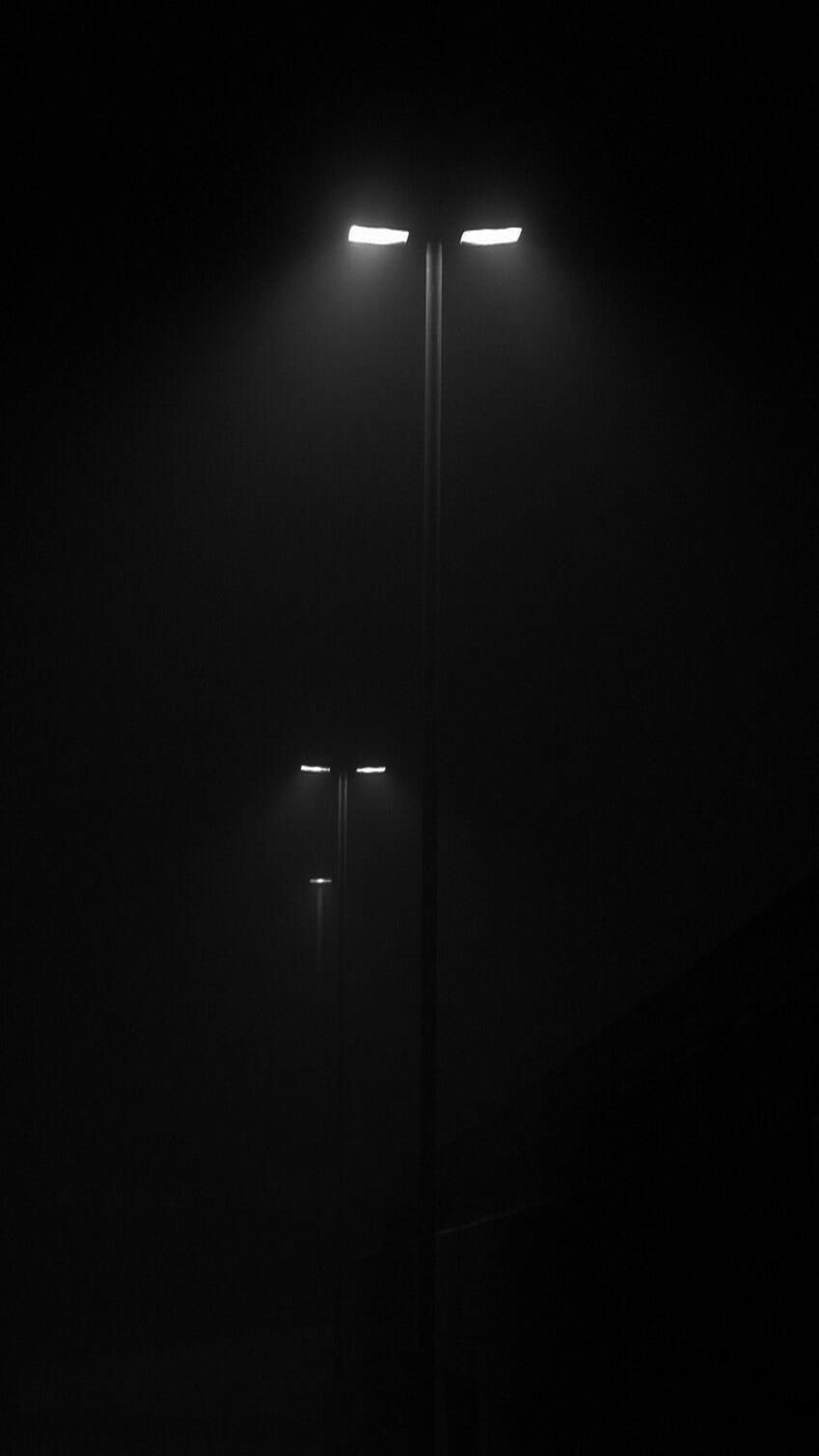 Arafed street light in the dark with a street sign on it (929, amoled, black, dark, minimal)