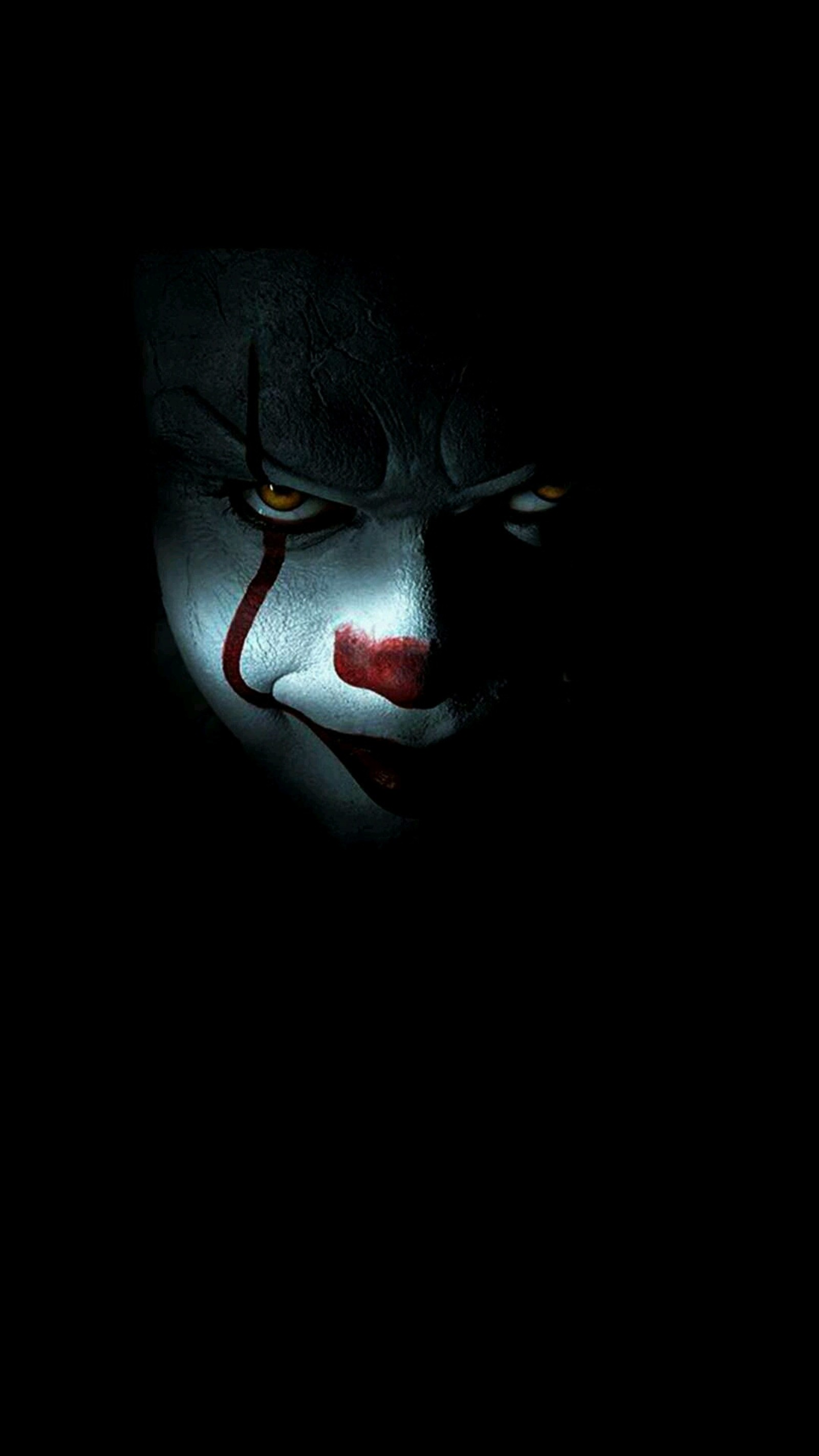 Arafed clown face in the dark with a red nose (awsome, batman enemy, black, joker)