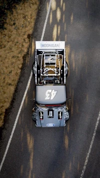 Top View of a Modified Automotive Vehicle on Asphalt Road