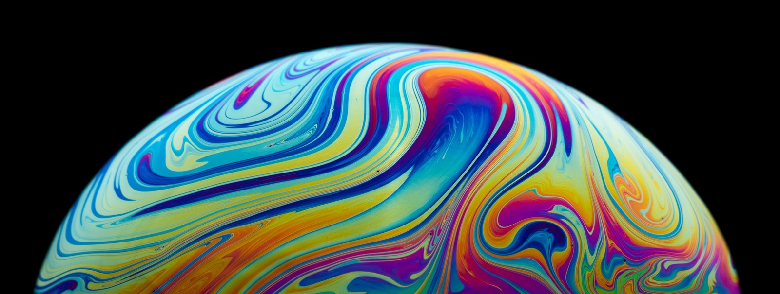 A close up of a colorful painted egg on a black background (soap bubble, planet illustration, modern art, painting, vibrant)