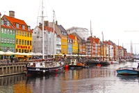 Vibrant Harbor Scene with Colorful Buildings and Moored Boats