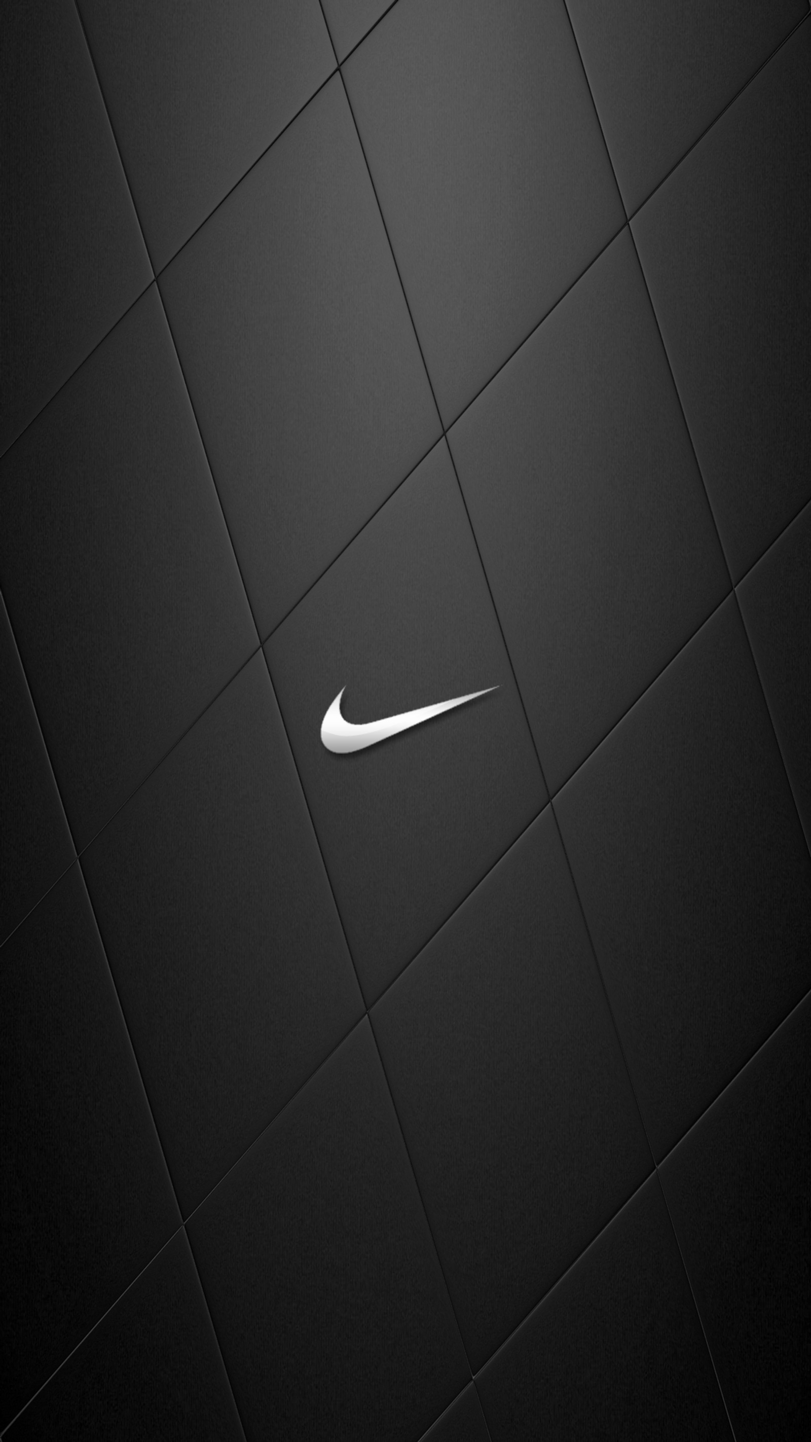 Un primer plano de un logo de nike en blanco y negro en una pared azulejada (logotipo, nike)