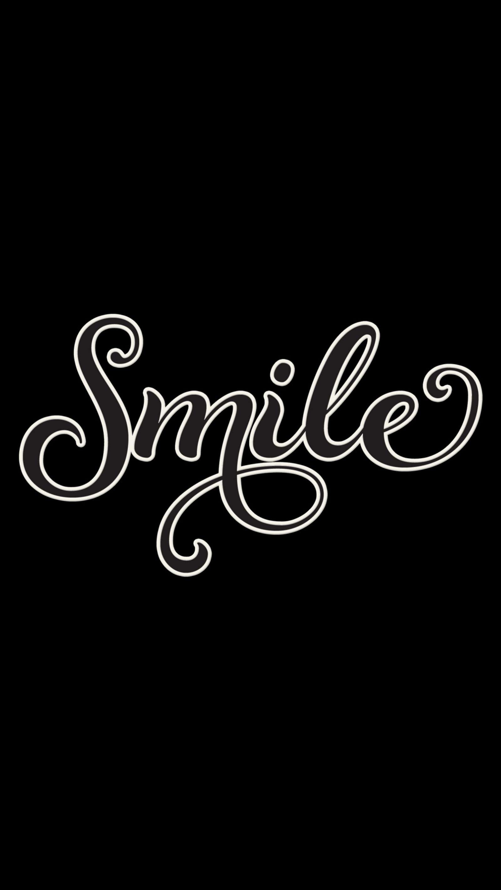 A close up of a black and white photo of a single script (smile, smiles)