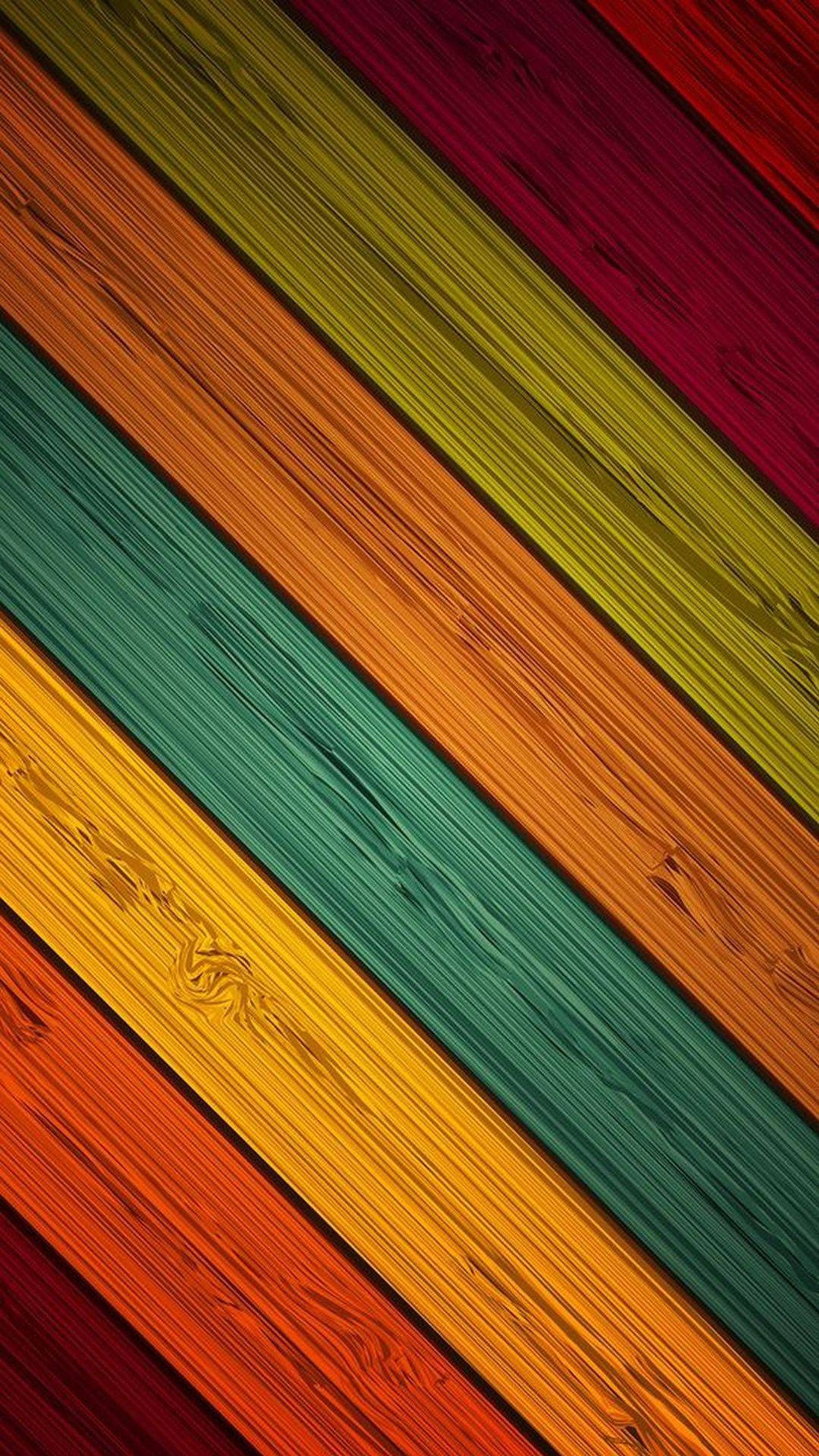 A close up of a wooden surface with different colors (colores, colorful, stitches, stripes)