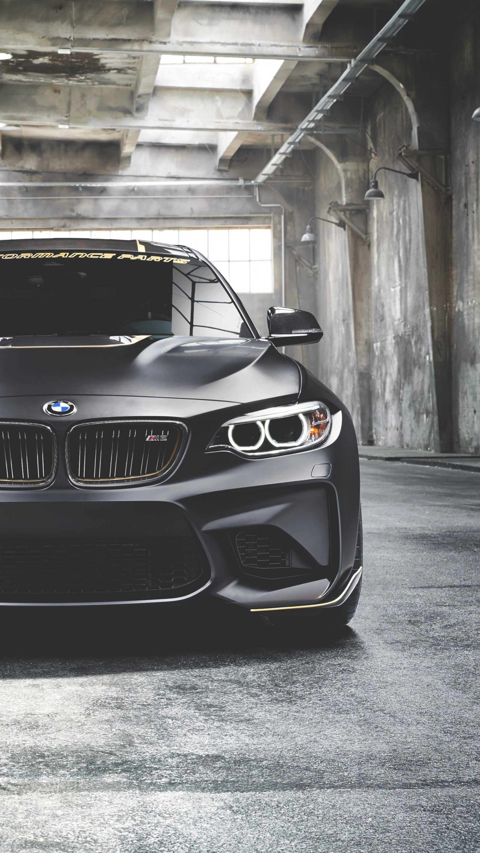 A close up of a black bmw sports car parked in a parking garage (bmw, car, coupe, m performance, m2)