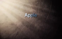 Logo de Apple sobre fondo oscuro texturizado con sutiles rayos de luz