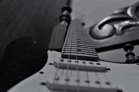 Close-Up of a Black and White Electric Guitar