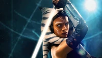 Ahsoka Tano empunhando um sabre de luz em uma pose cheia de ação da série Star Wars.