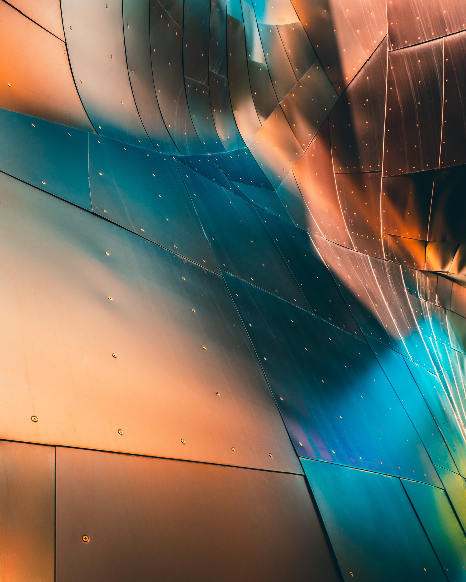 Arafed image of a building with a colorful metal structure (blue, light, orange, line, turquoise)