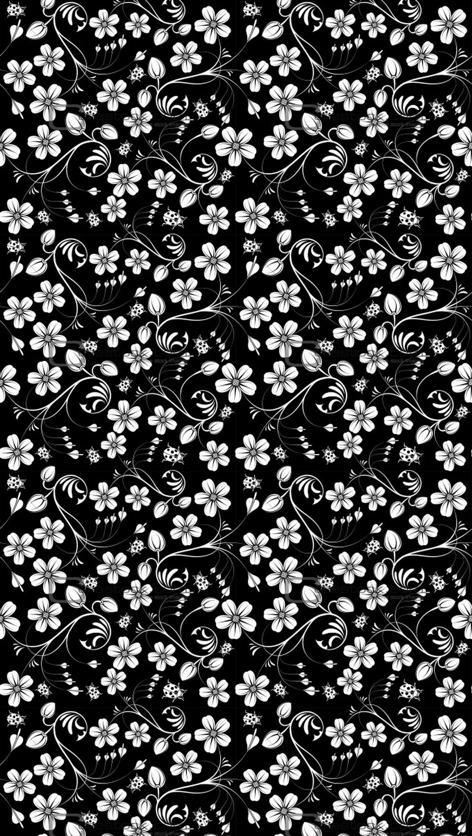 Un patrón floral en blanco y negro con flores blancas sobre fondo negro (flor, flores)