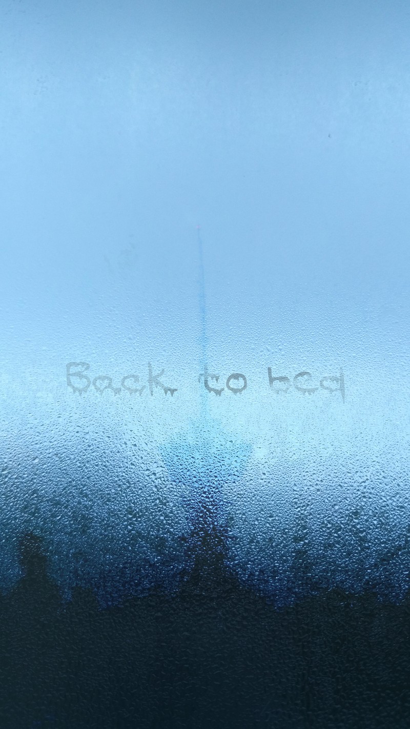 Arafed message written on a frosty window with trees in the background (bed, blue, city, dark, drop)