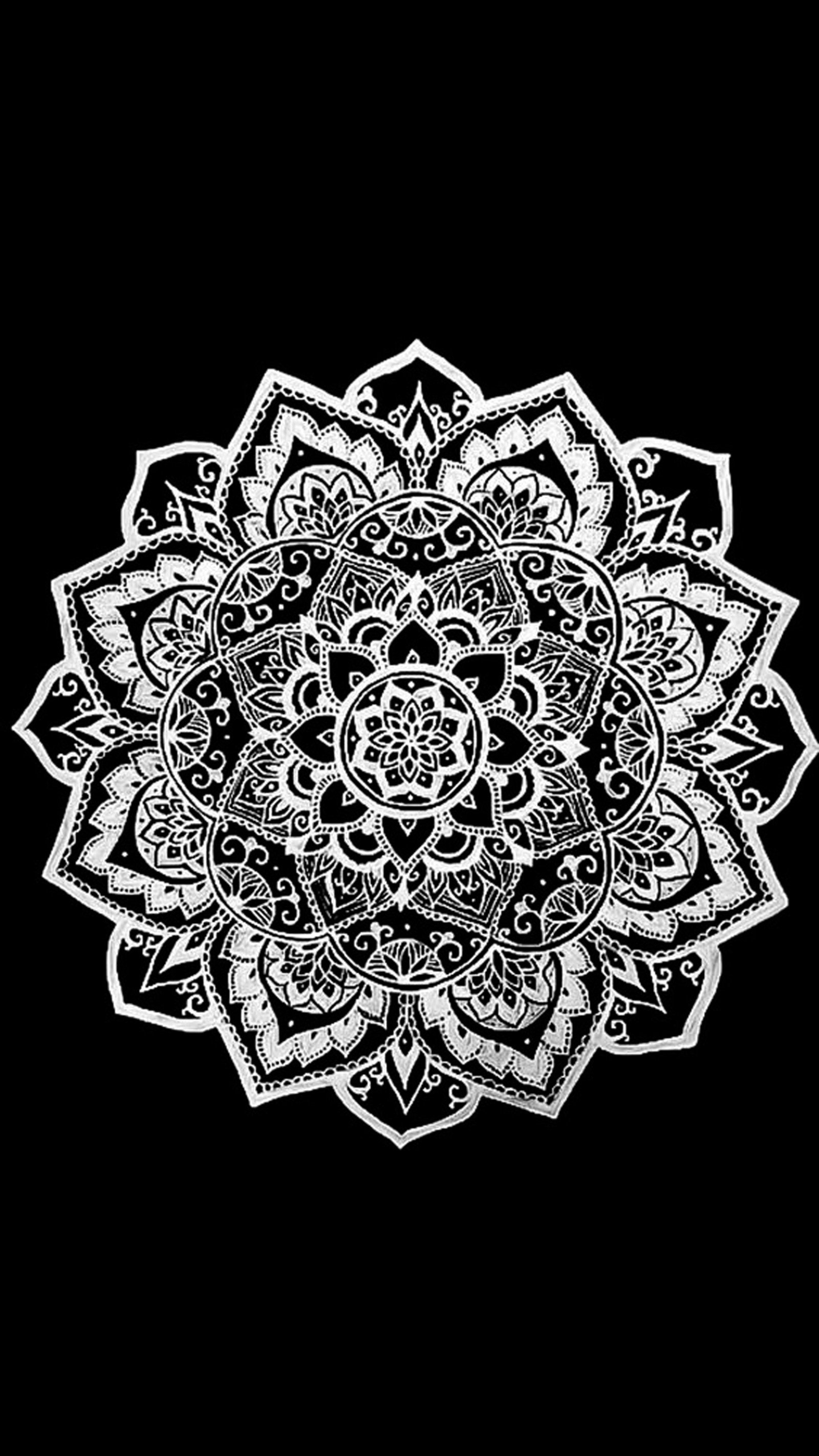 A black and white drawing of a flower on a black background (art, black, mandala, white)