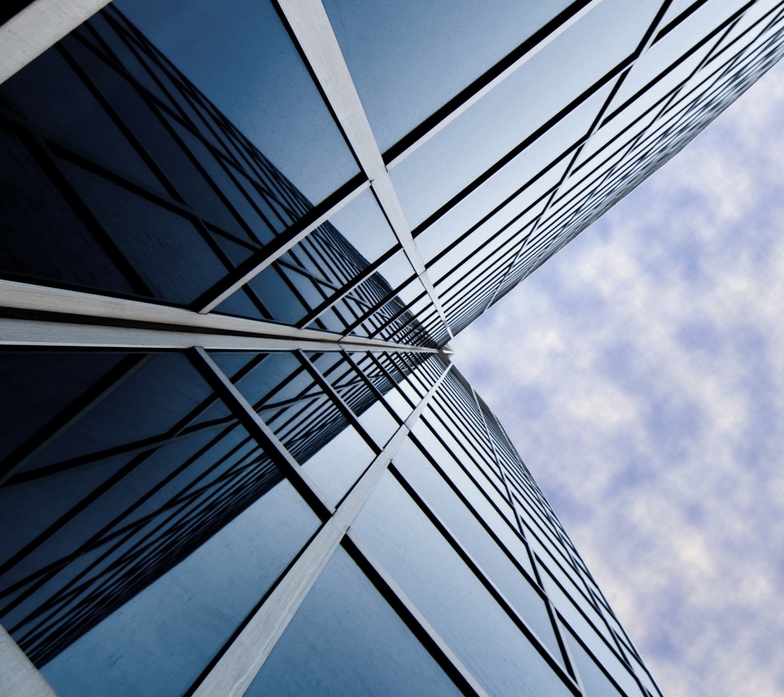 Arafed view of a building with a sky background (building, glass, htc, m7, tower)