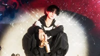 Ni-ki of ENHYPEN shines in a stylish pose, surrounded by a sparkling backdrop, embodying the energy of K-pop and the spirit of "Manifesto Day 1.