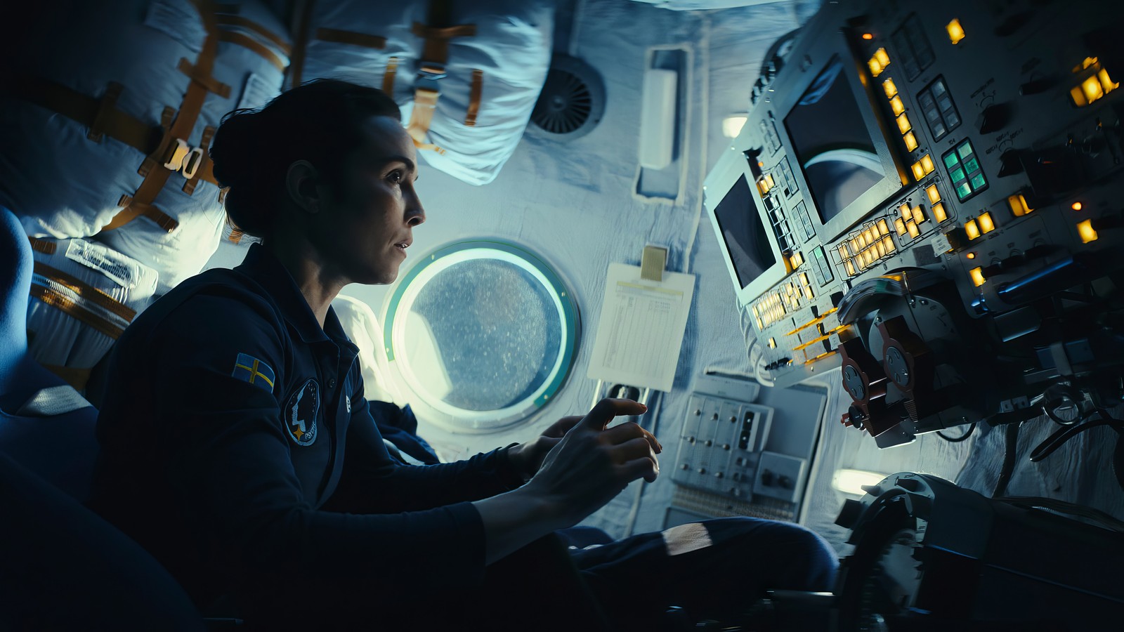 Arafed view of a woman in a space station with a monitor (constellation, astronaut, noomi rapace)