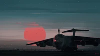 Silhouette eines Flugzeugs vor einem lebhaften Sonnenuntergang mit einer Figur, die auf seinem Flügel steht.