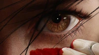 Close-Up of a Battle Angel's Eye with Dramatic Red Accents