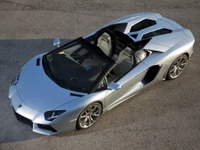 Sleek silver Lamborghini Aventador Roadster showcasing cutting-edge automotive design.