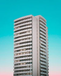 Modern Skyscraper with Unique Facade Design Against a Clear Sky