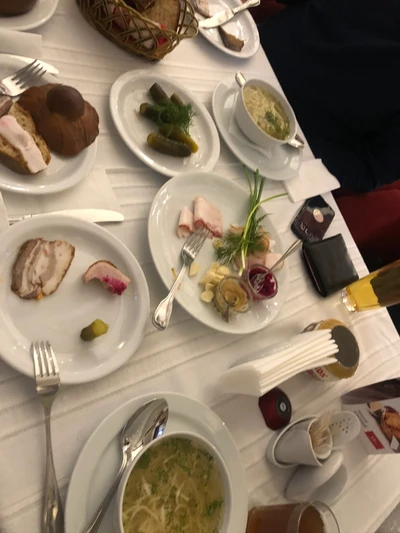 A beautifully arranged seafood breakfast spread featuring various dishes, garnishes, and drinks on elegant dishware.