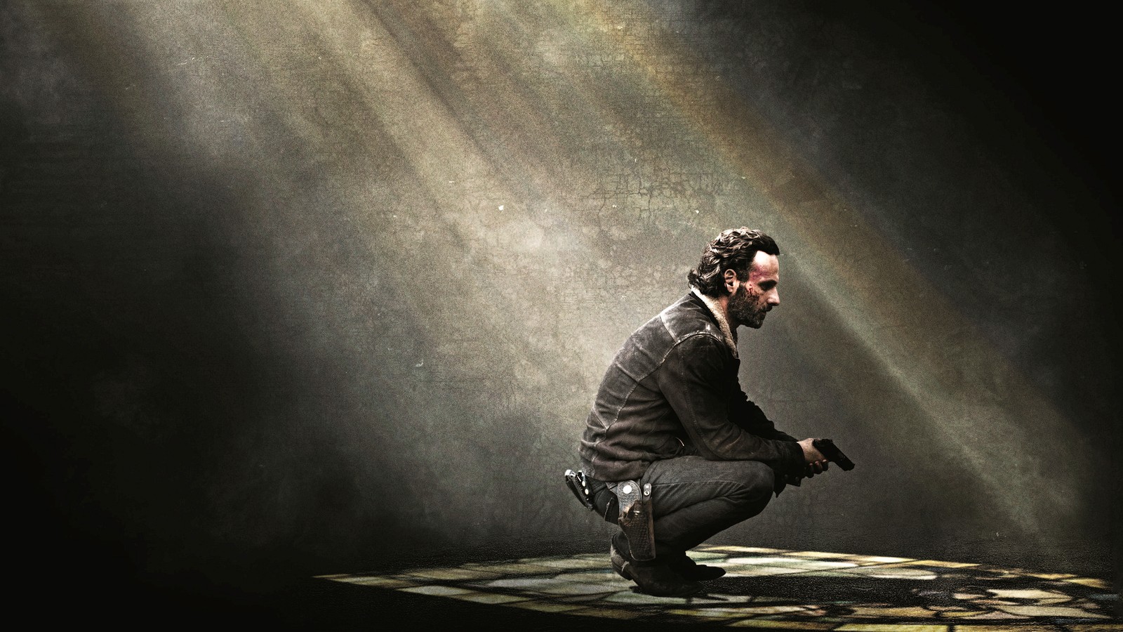 Ein mann, der in einem dunklen raum mit licht auf sich kniet (rick grimes, the walking dead, filme, 4k hintergrund)