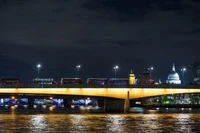 London Bridge at Night: A Stunning Cityscape with Reflections and Iconic Landmarks