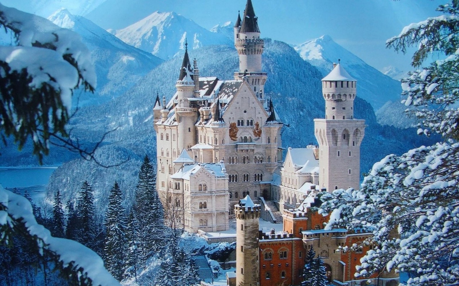 A close up of a castle in the middle of a snowy mountain (neuschwanstein castle, landmark, mountain range, kruger national park, mountains)