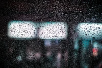 Raindrops on Glass with Blurred Background