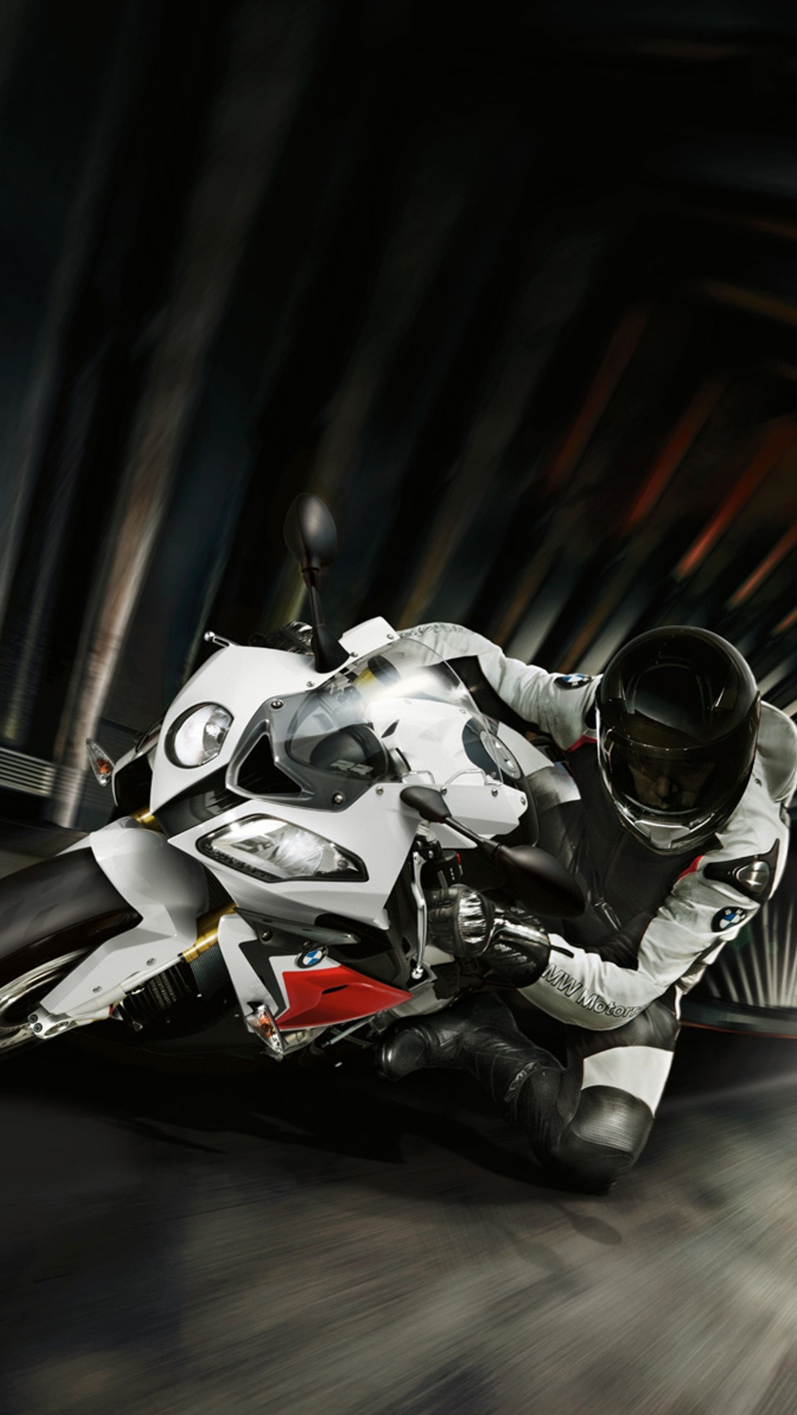 Motorcycle rider in motion on a dark street with a tunnel in the background (bike, bmw, motor, s1000)