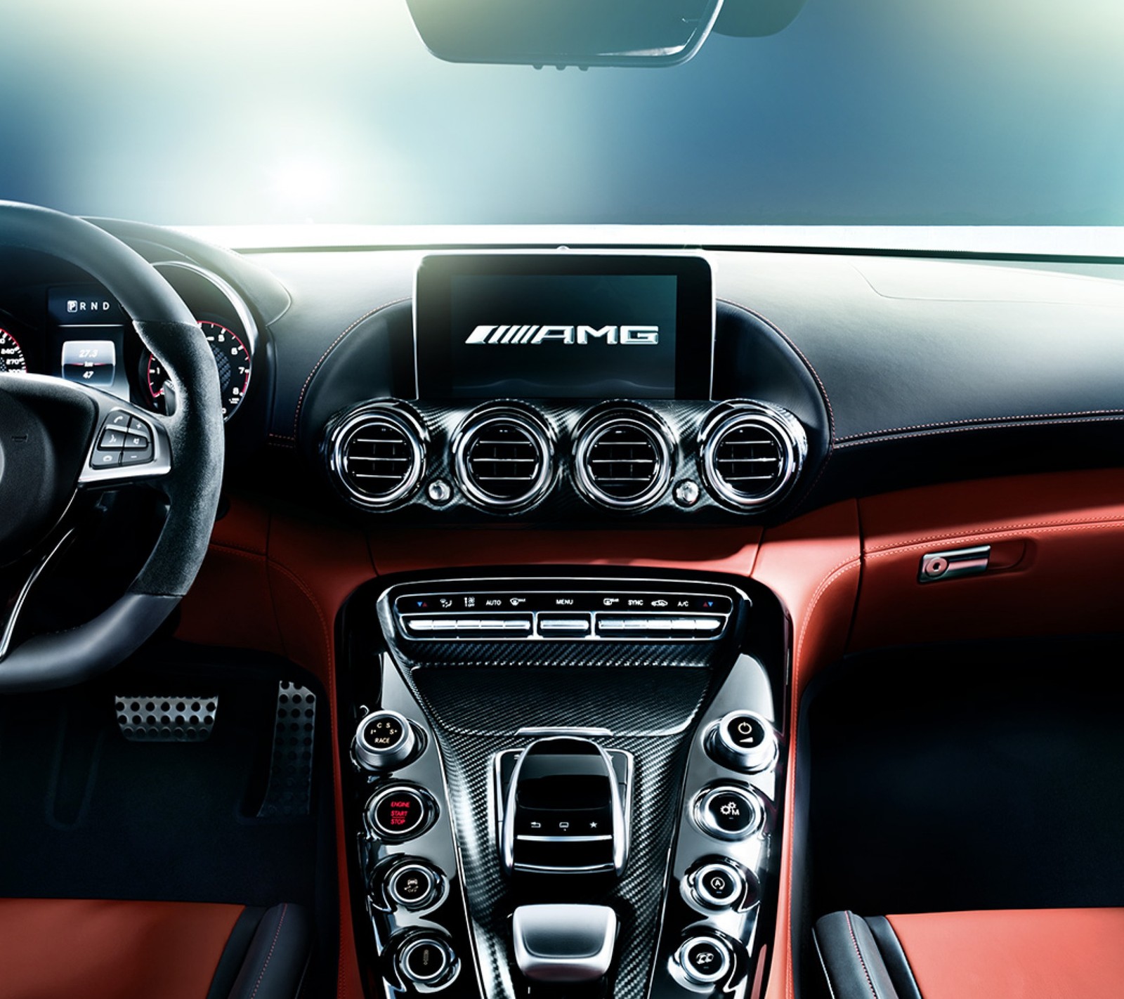 A close up of a car dashboard with a steering wheel and dashboard controls (amg, cars, supercar)