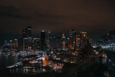 Sydney's Illuminated Skyline: A Nighttime Cityscape of Urban Elegance