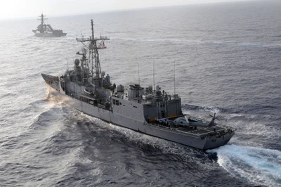 US Navy Frigate and Destroyer Navigating Open Waters