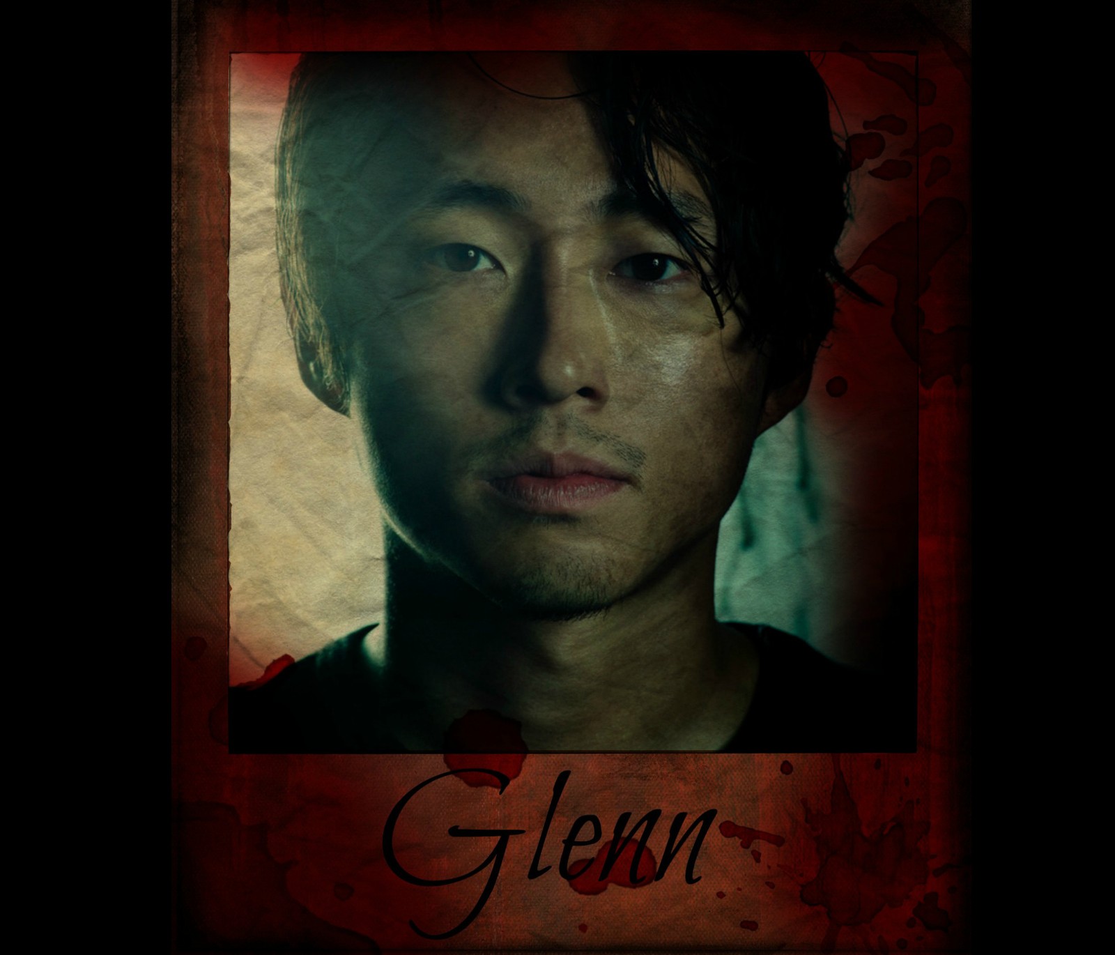 A close up of a man with a picture of himself on a poster (glenn rhee, the walking dead, twd)